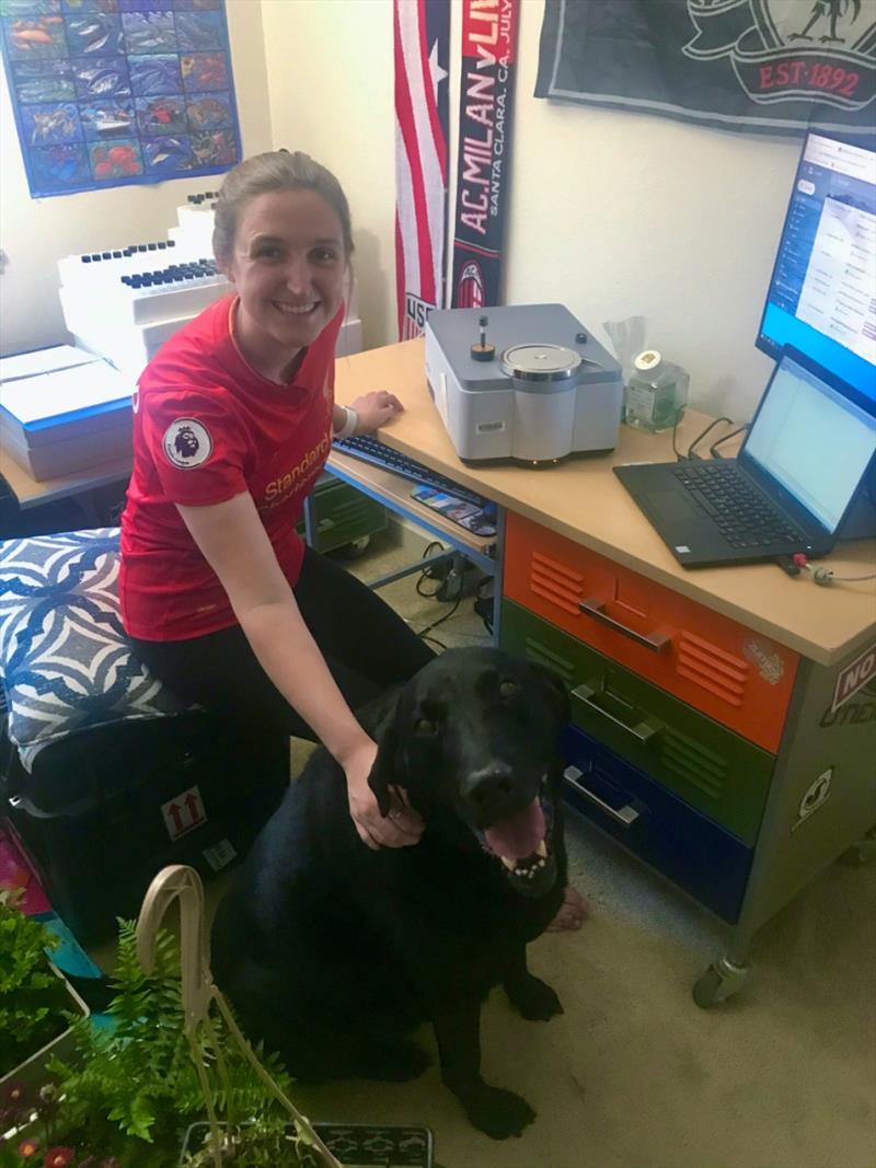 Brenna Groom with her dog,Tag, and the mobile near-infrared scanner affectionately named `Tango.` photo copyright NOAA Fisheries taken at 