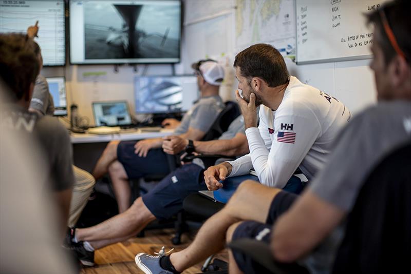 The American Magic team reviews data from a practice session photo copyright Amory Ross taken at 