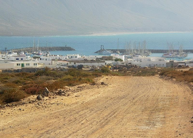 Graciosa Town and Marina with Lanzarote in background - photo © Hugh & Heather Bacon