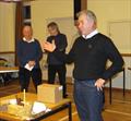 © John Sproat Willie the social hero launching into a lecture on the history, and his tribute; a cake-model of the first successful steamboat, the “Charlotte Dundas”, his 2018 Bake-Off competition entry © John Sproat