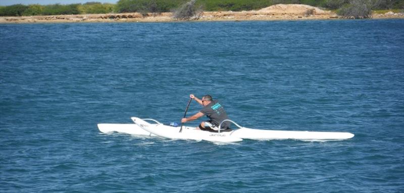 Seal Biologist David Schofield paddling his OC1 canoe off the Hawaiian shore photo copyright New Hope Canoe Club taken at 