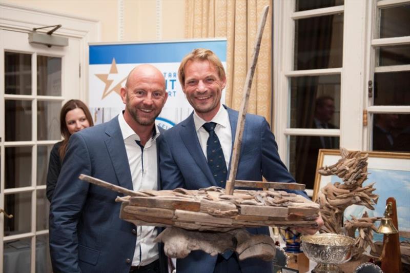 Richard Klabbers, Sevenstar's Managing Director (right) presents awards to Ian Walker whose record monohull run on VO 65 Azzam Abu Dhabi Ocean Racing of 4 days 13 hrs 10 mins 28 secs is the benchmark to beat in the 2022 race - photo © RORC