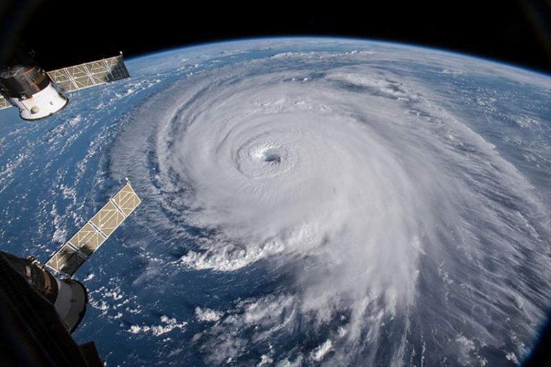 A dramatic view of Hurricane Florence as seen from the International Space Station. A tropical cyclone is a generic term for a rapidly rotating tropical storm with a low-pressure center and clouds spiraling toward the center of the system photo copyright NASA Goddard Space Flight Center / Flickr taken at 