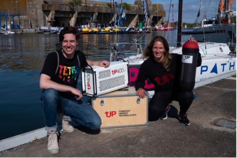 PowerUP Energy Technologies' CEO, Dr. Ivar Kruusenberg with Russian Class mini sailor Irina Gracheva at the Lorient Port, France photo copyright PowerUP Energy Technologies taken at 