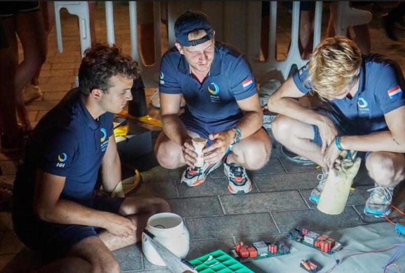 Team members investigate the damage and possible solutions photo copyright TU Delft Solar Boat Team taken at 