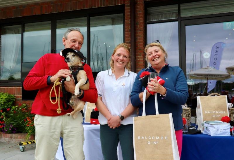 Jonty Sherwill and Vicki Weston with Toby, collecting their Salcombe Gin and Harken goodies from RSrnYC Sailing Secretary, Emily Robertson photo copyright Louay Habib taken at Royal Southern Yacht Club