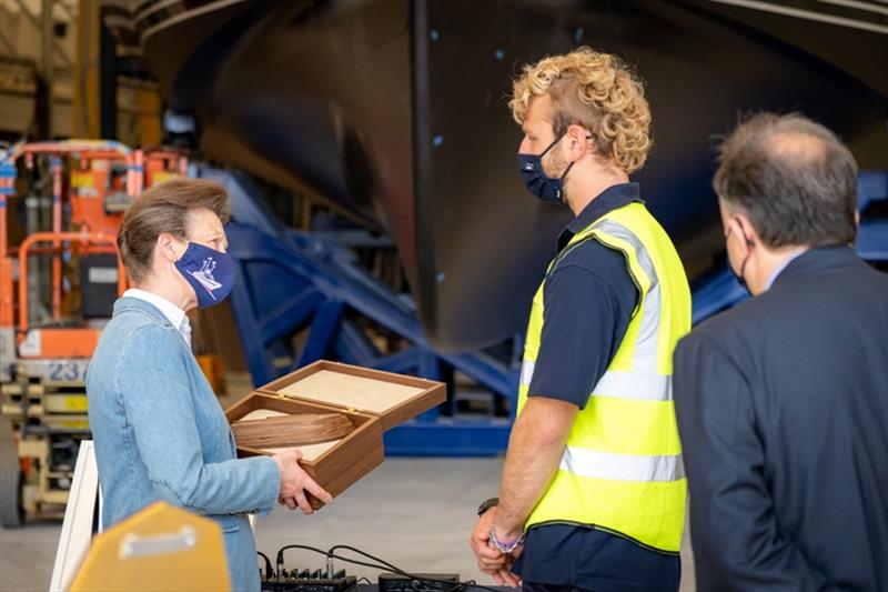 HRH receiving a gift of a wooden yacht from apprentice Freddie Ambrose - photo © Princess Yachts