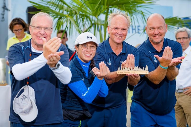 They want to keep on sailing, according to their proud sign, the deaf crew Jürgen Keuchel, Karen Maren Suthmann, helmsman Markus Halle and Jan Lichtenberger (from left). - photo © Sascha Klahn