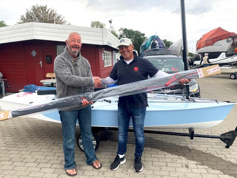 Bo Petersen receives his prize, a new Art of Racing boom, from Art of Racing's European distributor, Greg Wilcox photo copyright Robert Deaves taken at 