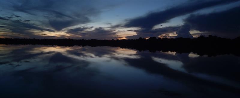 Rain clouds gathering over an evening on the Jauaperi river - from Garden of Evil photo copyright Mediawave taken at Royal New Zealand Yacht Squadron