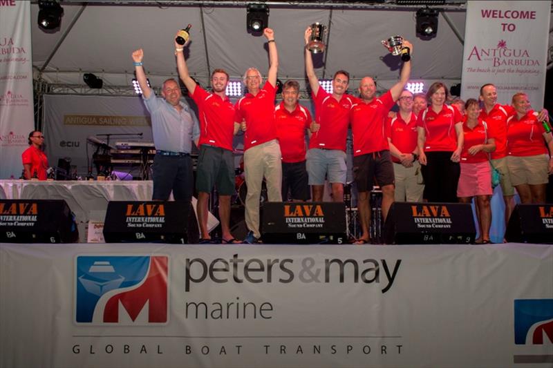 The crew of Scarlett Oyster along with Craig Stanbury of Peters & May at the post-race prizegiving photo copyright Ted Martin taken at Antigua Yacht Club