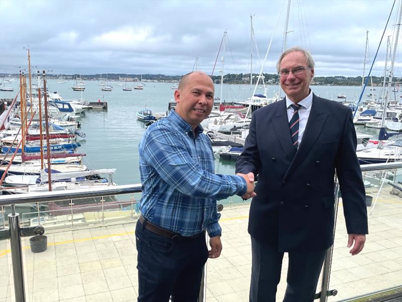 John O’Donnell of International Paint shakes hand with Andrew Pearce, Poole Regatta President photo copyright Poole Regatta Committee taken at Royal Motor Yacht Club, England