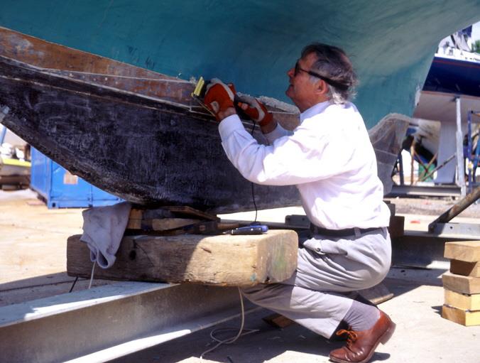 Malcolm Donald working on the hull of Celia Mary photo copyright Malcolm Donald Collection taken at Hamble River Sailing Club