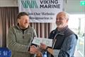 Conor O’Leary collecting overall prizes for other members of the ILCA 7 fleet from sponsor Ian O’Meara - Viking Marine Frostbite Series prize-giving at Dun Laoghaire © Frank Miller