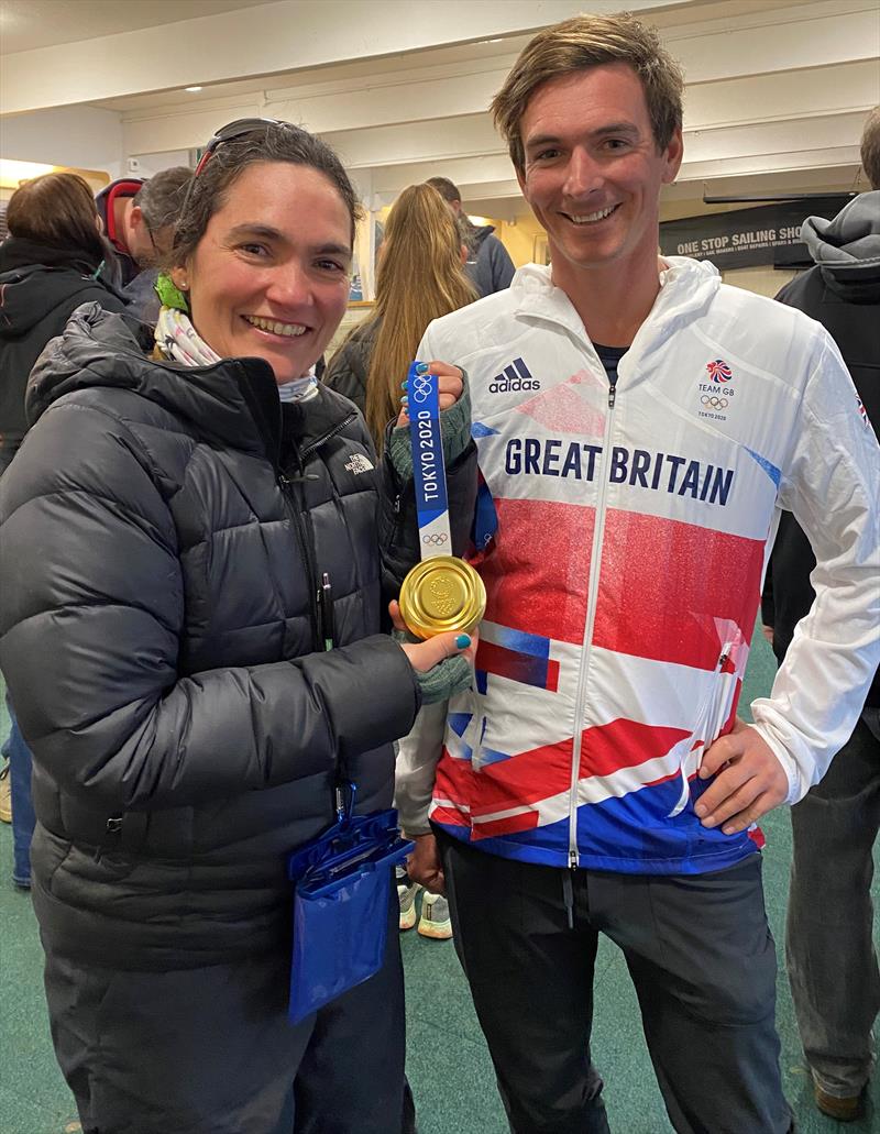 Dylan showing his gold medal to Maria Elvira Franco, a member of Northampton Sailing Club photo copyright Charlotte Fletcher-Scott taken at Northampton Sailing Club