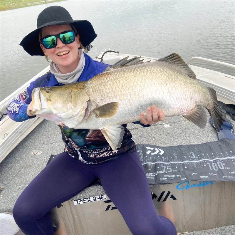 Tayla with a solid 97cm barra from Lake Monduran, great job on the landing net Ben! photo copyright Fisho's Tackle World taken at 