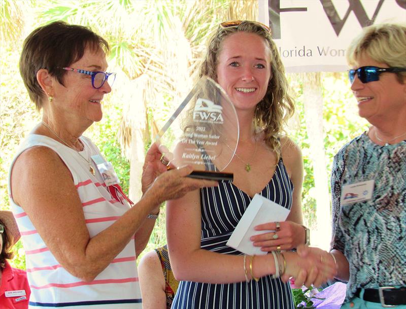 Fran Mericle (left), Chair of the FWSA Young Women's Sailor Award, presents the 2022 YWSYA keeper trophy to Kaitlyn Liebel of Bradenton, with Linda Schwartz, FWSA President, presenting her with a $3,000 check to aid in her continued sailing competitions photo copyright Nancy Marik taken at 