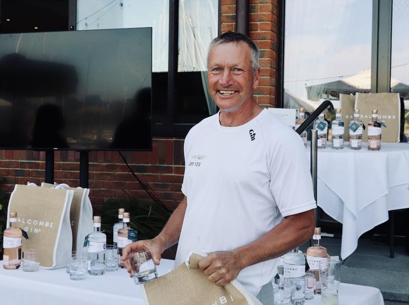Ian Southworth collects his prize during the Salcombe Gin July Regatta at the Royal Southern YC photo copyright Paul Wyeth / RSrnYC taken at Royal Southern Yacht Club