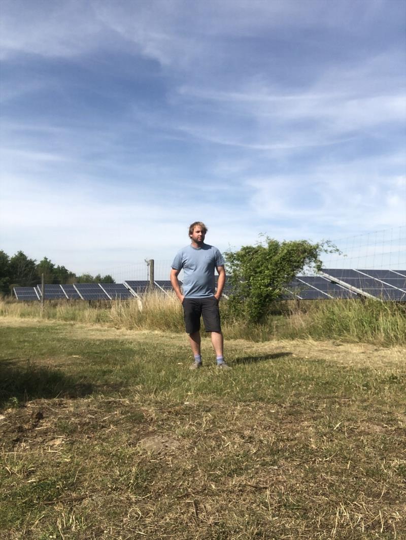 Will Croxford next to his family's solar park - photo © Global Solo Challenge