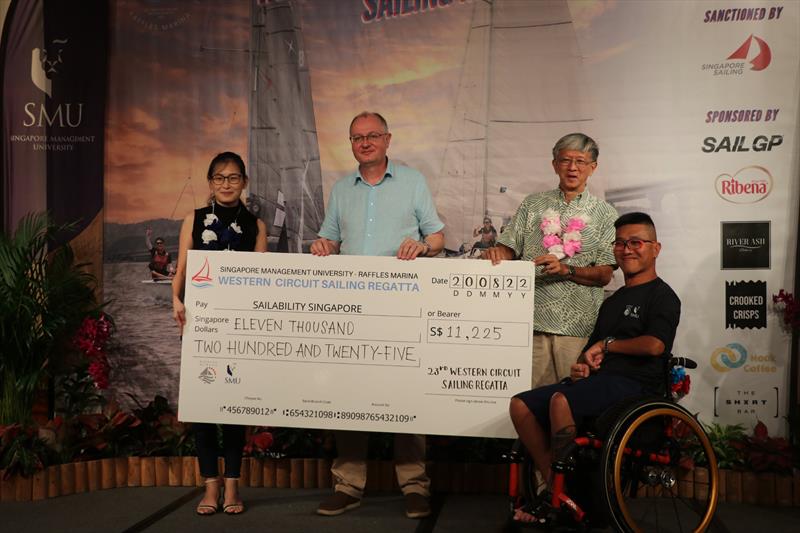 Presentation of cheque to Sailability Singapore - photo © Raffles Marina