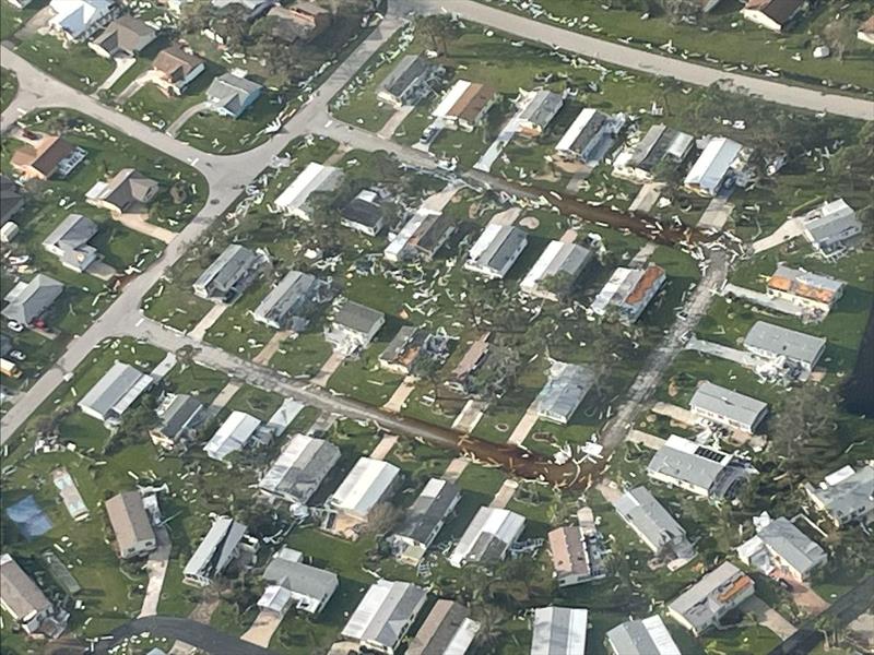 A U.S. Coast Guard aircrew from Air Station Miami, Florida, conducts overflights around the Fort Myers area in the wake of Hurricane Ian, Sept. 29, 2022. Some of the things crews look out for are people in distress, scope of damage and potential pollution photo copyright Petty Officer 3rd Class Kruz Sanders taken at 