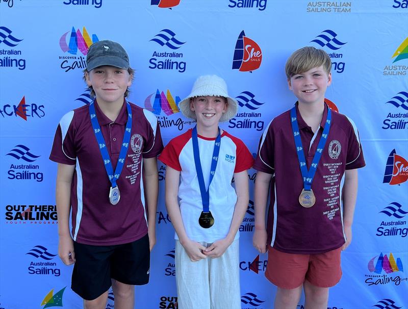 Caelan Bryt, Alyssa Mathieu and Laken Eaton after receiving their medals - 2022 QLD Youth Championships photo copyright Australian Sailing taken at Keppel Bay Sailing Club