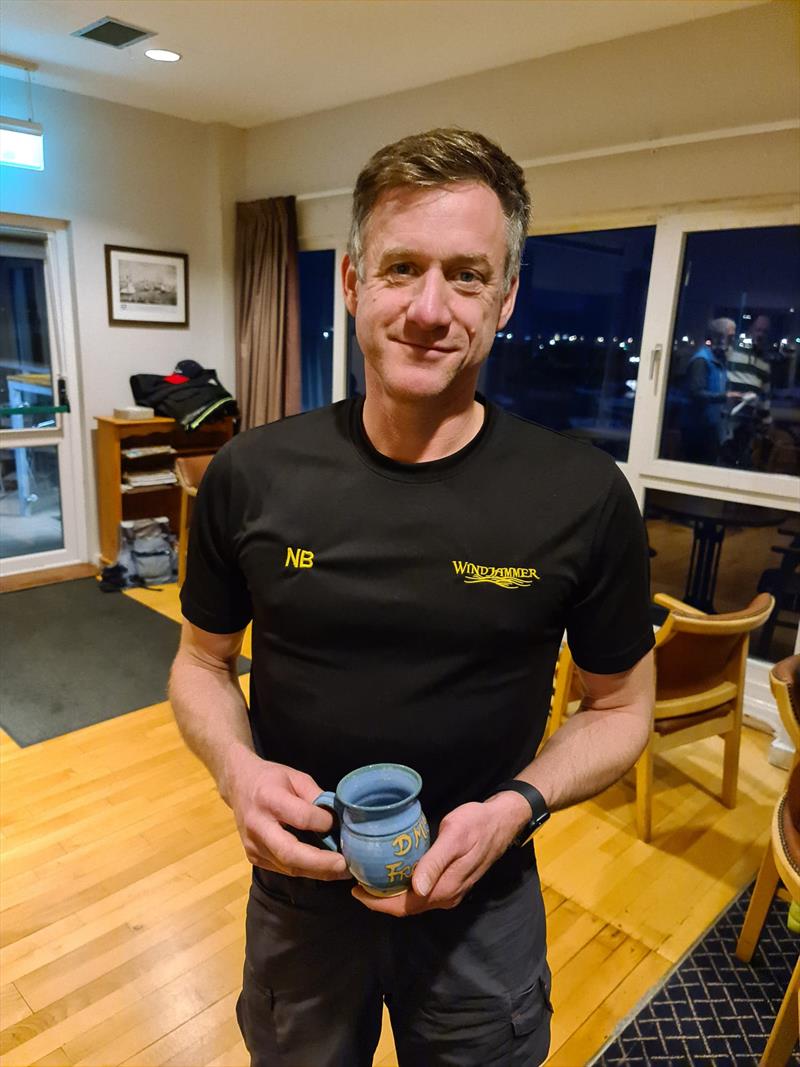 Noel Butler picks up a Frostbite Mug for Race 2 of the Series. Noel is in pole position at the conclusion of Dun Laoghaire Frostbite Series 1, ahead of two other Aeros in Roy Van Mannen and Stephen Oram photo copyright Frank Miller taken at Dun Laoghaire Motor Yacht Club