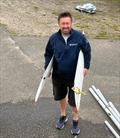 Tony Bishop with a pair of ILCA daggerboards