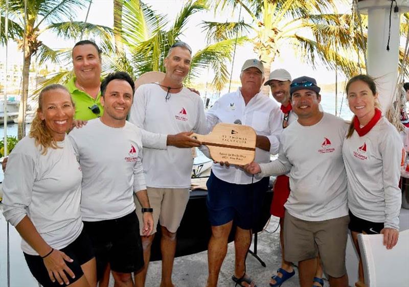 Bastian Sarh's Chili Pepper team accepts their Round the Rocks prize photo copyright Dean Barnes taken at St. Thomas Yacht Club