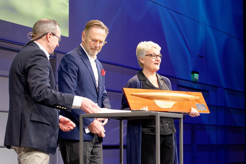 John Lammerts van Bueren and Kim Weckström presenting the award to The Burre Hellman foundation CEO Charlotte Hellman photo copyright Erik Lahteenmaki taken at 