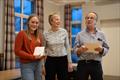 Solway Yacht Club annual Prize Giving: Tamsin Wallace, winner with her crew, Keiran Ganeri, of the Heather Dodds Sportsmanship Trophy having shown outstanding good sportsmanship during Cadet week, presented by Liz Train (centre) with Scott Train © Nicola McColm