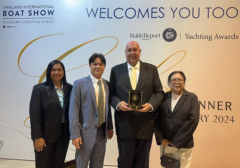 Napong Paripontpochanapisuti, Managing Director of Ocean Property Co. Ltd. (second left) and Scott Finsten, Harbour Master of Ocean Marina Jomtien (second right) receiving the award with some of the Ocean Marina Jomtien team photo copyright Ocean Marina Jomtien taken at 