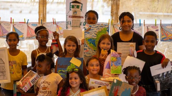 Young artists from local schools proudly show their Regatta artwork and prizes at the Annual Regatta Art Competition hosted by the Sint Maarten Yacht Club - photo © Digital Island