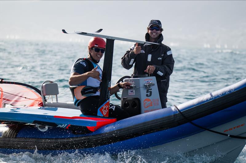 Men's iQFOiL athlete Noah Lyons and USST Men's iQFOiL Coach Juanma Moreno smile for the camera photo copyright US Sailing Team taken at Real Club Náutico de Palma