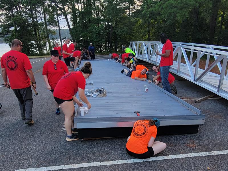 SMART Local 85 and IBEW Local 613 union volunteers preparing the floating dock for installation next to Blockhouse Boat Ramp on Lake Allatoona photo copyright Union Sportsmen's Alliance taken at 