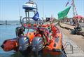 The Mayor and his wife sit beside the lifeboat on the pontoon during the Mengeham Rythe Sailing Club 75th Anniversary Celebrations