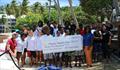 Junior Sailing Summer Program graduates, St. Thomas Sailing Center staff, and representatives from VIPCA and RapierMed on the beach in front of the St. Thomas Yacht Club © STSC / C. Bareuther