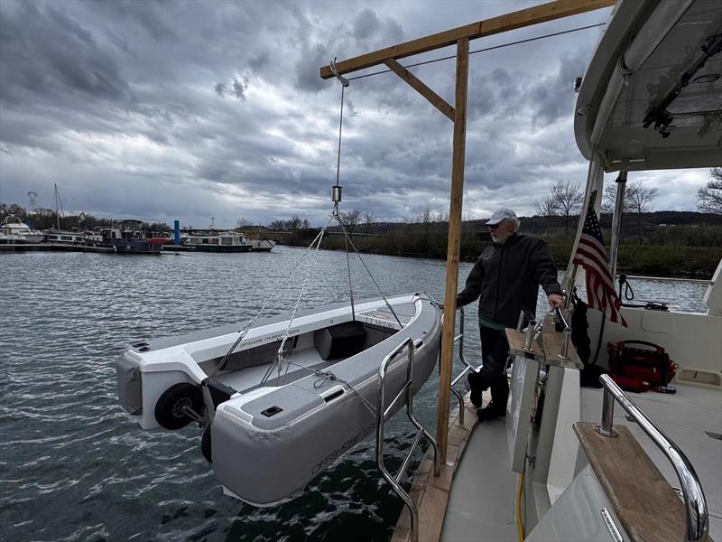 Tom built a makeshift davit for the tender and installed it on the protective boards fitted to the transom - photo © Nordhavn