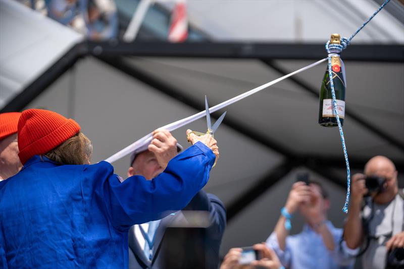 Dr Sylvia Earle cutting the ribbon to christen the boat with a champagne bottle - photo © Marie Lefloch | Team Malizia