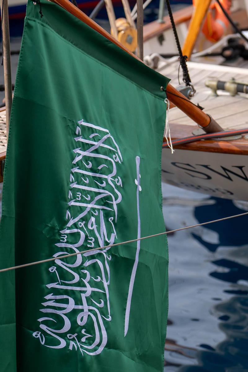 Saudi National flag flies on Black Swan photo copyright Ian Roman taken at AMAALA Yacht Club