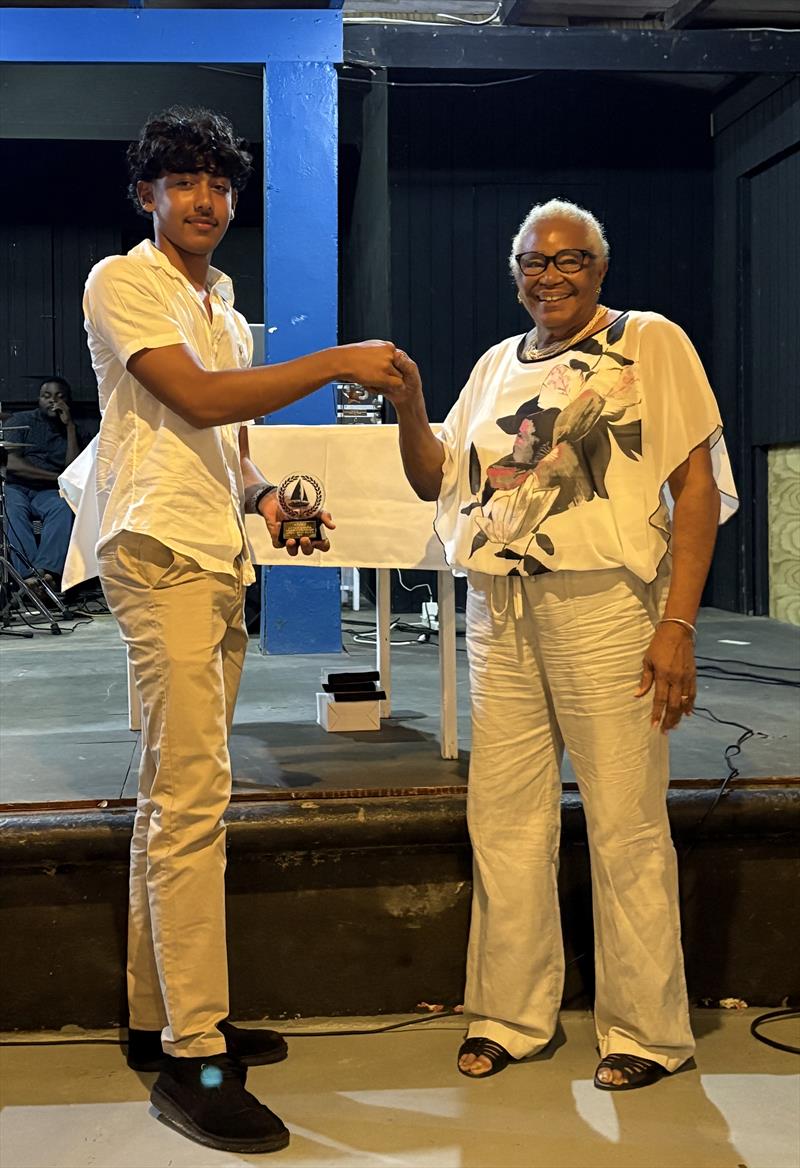 Mrs Joan Simmons presenting the Sylvester Simmons Young Sailor of the Year award to Kai Marks Dasent - photo © SVG Sailing