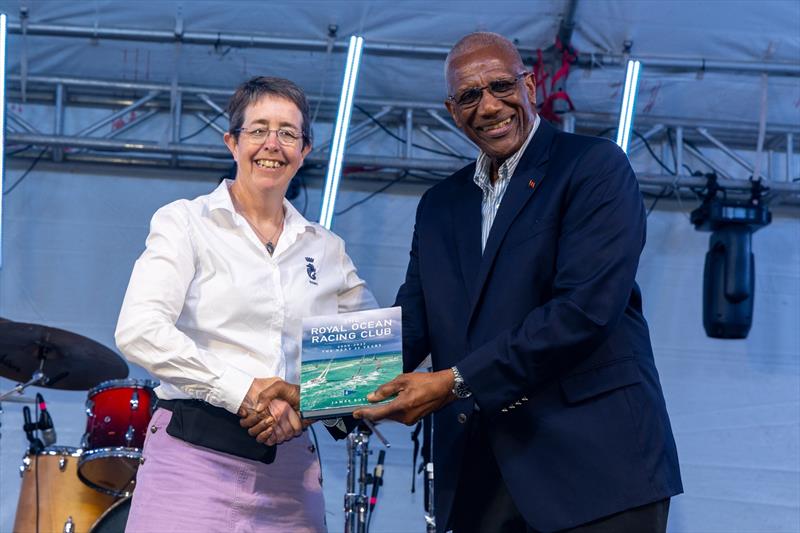 RORC Commodore Deb Fish presents His Excellency, Sir Rodney Williams, Governor General of Antigua & Barbuda with the RORC centenary history book 2000-2025 - photo © Tim Wright / Photoaction.com