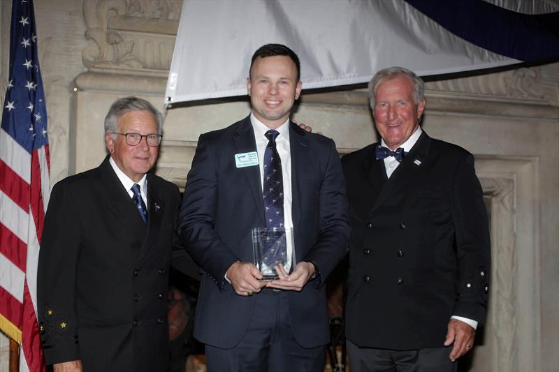 Peter Gibbons-Neff Jr., receives the 2025 Charles H. Vilas Literary Prize, with the incoming CCA Commodore Chace Anderson, left, and outgoing CCA Commodore Jay Gowell photo copyright Guy Gurney taken at Cruising Club of America