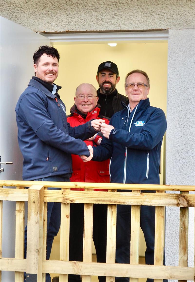 Handover day of the new facility, Paul Widdowson (left), and Martin Stitt (rear) Directors of South West Trades hand the keys to Scott Train, Commodore of the Solway Yacht Club with Robert Dinwiddie, past Commodore (centre) photo copyright Kerry Widdowson taken at Solway Yacht Club