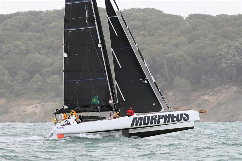 Morpheus passes Hurst Castle after the Rolex Fastnet Race start photo copyright Mark Jardine taken at Royal Ocean Racing Club and featuring the MOCRA class