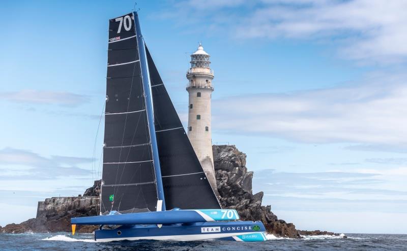 Concise 10 rounds the rock in the Rolex Fastnet Race photo copyright Rolex / Kurt Arrig taken at Royal Ocean Racing Club and featuring the MOD70 class