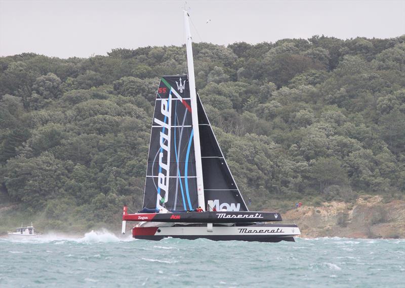 Maserati passes Hurst Castle after the Rolex Fastnet Race start photo copyright Mark Jardine taken at Royal Ocean Racing Club and featuring the MOD70 class