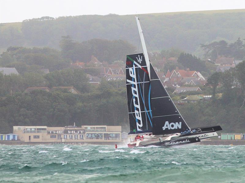 Maserati passes The Hut after the Rolex Fastnet Race start photo copyright Mark Jardine taken at Royal Ocean Racing Club and featuring the MOD70 class