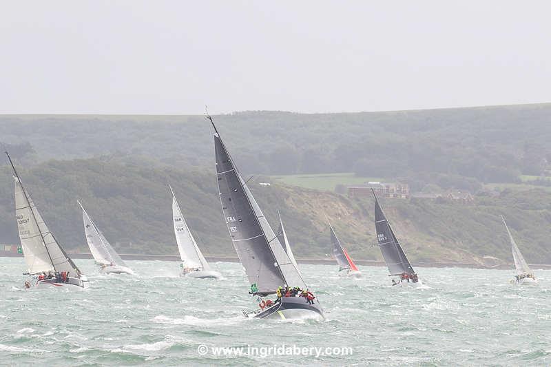 The Rolex Fastnet Race fleet pass Hurst Castle photo copyright Ingrid Abery / www.ingridabery.com taken at Royal Ocean Racing Club and featuring the MOD70 class