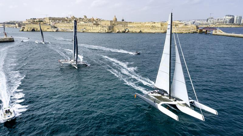 The multihulls, led by Mana and Maserati Multi 70, exit Grand Harbour following the start of the 2021 Rolex Middle Sea Race photo copyright Kurt Arrigo / Rolex taken at Royal Malta Yacht Club and featuring the MOD70 class